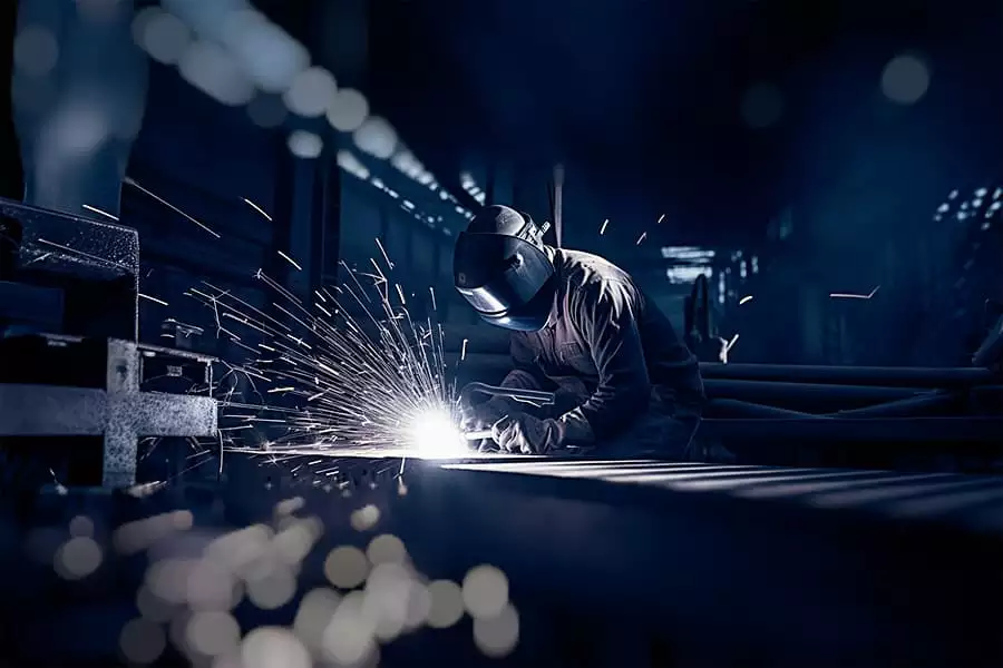 GMAW welding inside a factory.