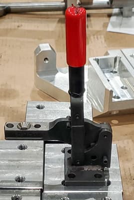 A clamp plays a part in custom fixturing