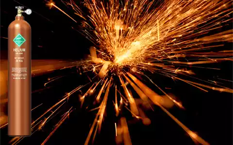 Helium gas tank in front of welding sparks.