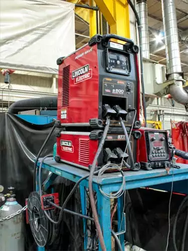 Lincoln Electric Welding Unit on a workbench.