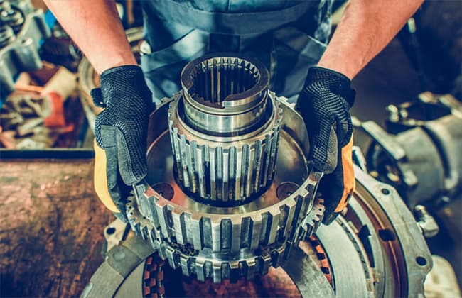 Man working maintenance on industrial equipment.