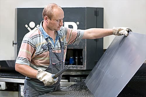 man working with sheet metal