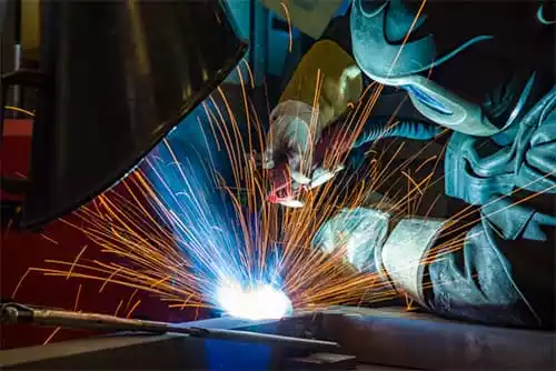 Person welding using FCAW.
